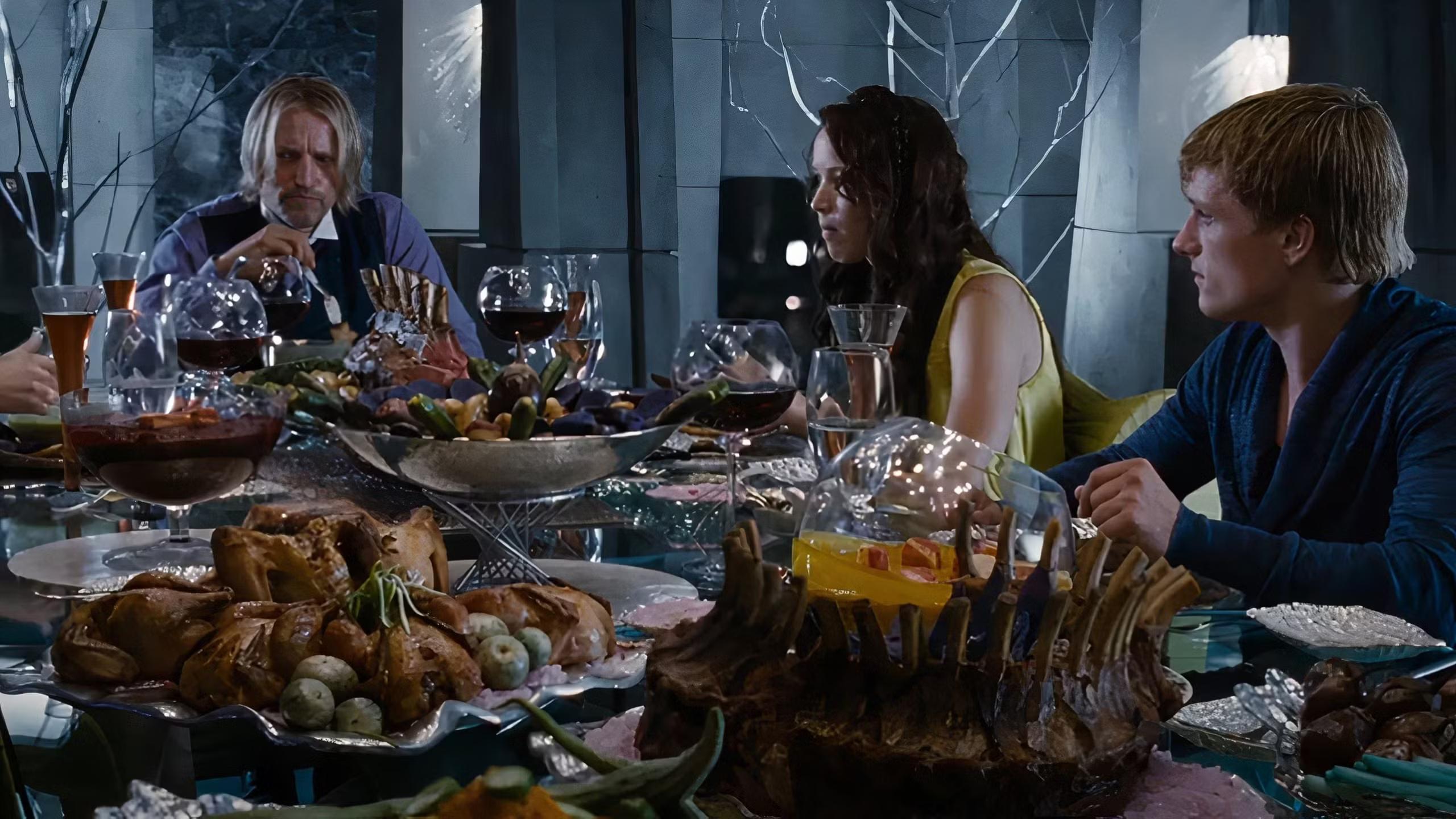 Katniss, Peeta, and Haymitch having dinner in the Training Centre. (Effie is just out of shot)